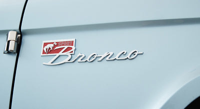 Light blue Classic Ford Bronco body with Sport Bronco emblem near door hinge