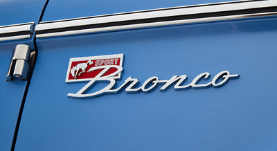 Blue Classic Ford Bronco door panel with sport Bronco emblem