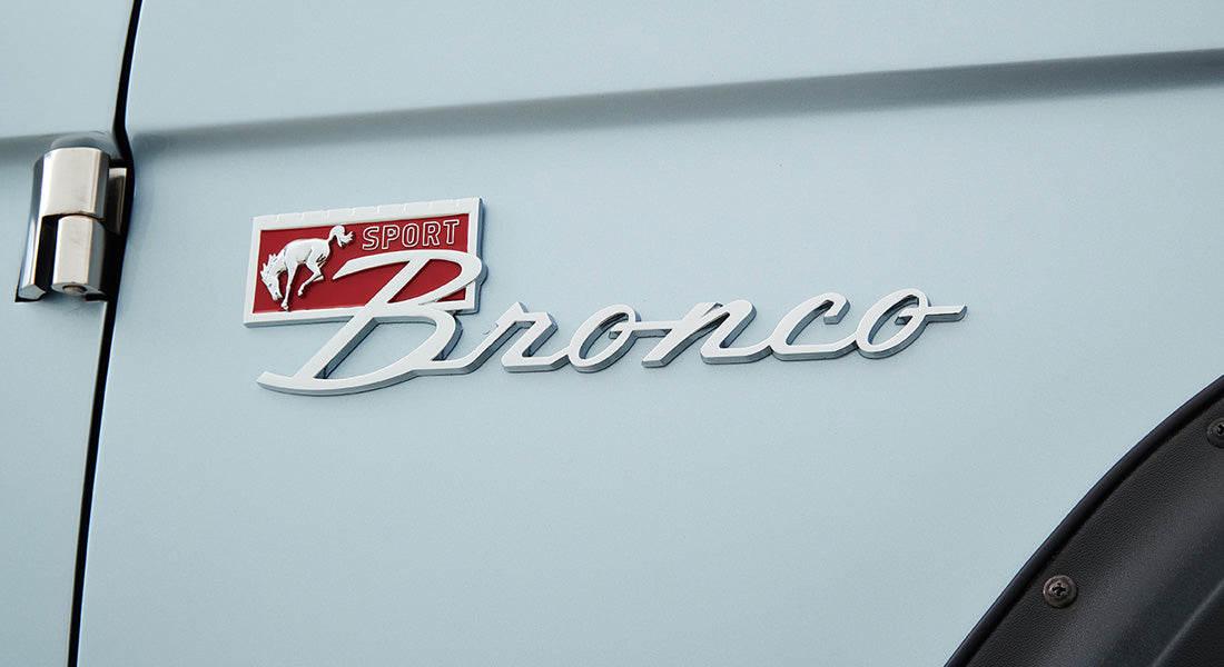 Classic Ford Bronco side emblem featuring running horse and Sport Bronco script