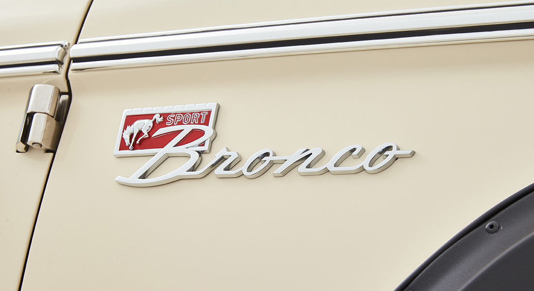 Classic Ford Bronco Sport emblem on cream exterior door