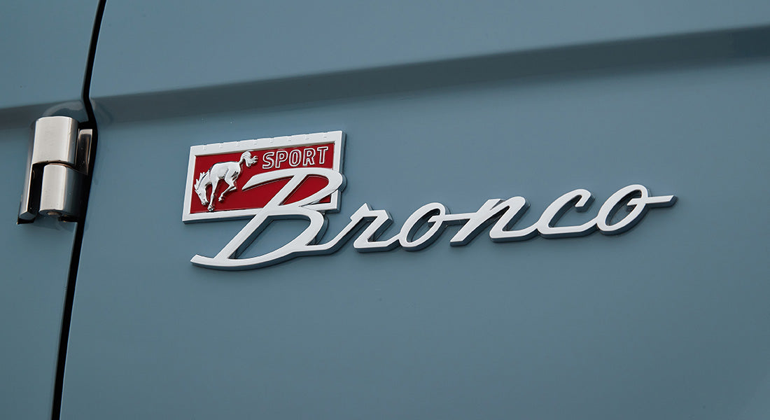 Classic Ford Bronco exterior side emblem featuring a running horse and the word Sport Bronco