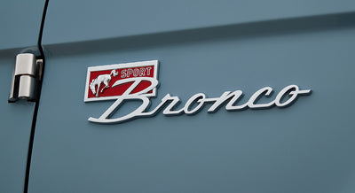 Classic Ford Bronco exterior side emblem featuring a running horse and the word Sport Bronco