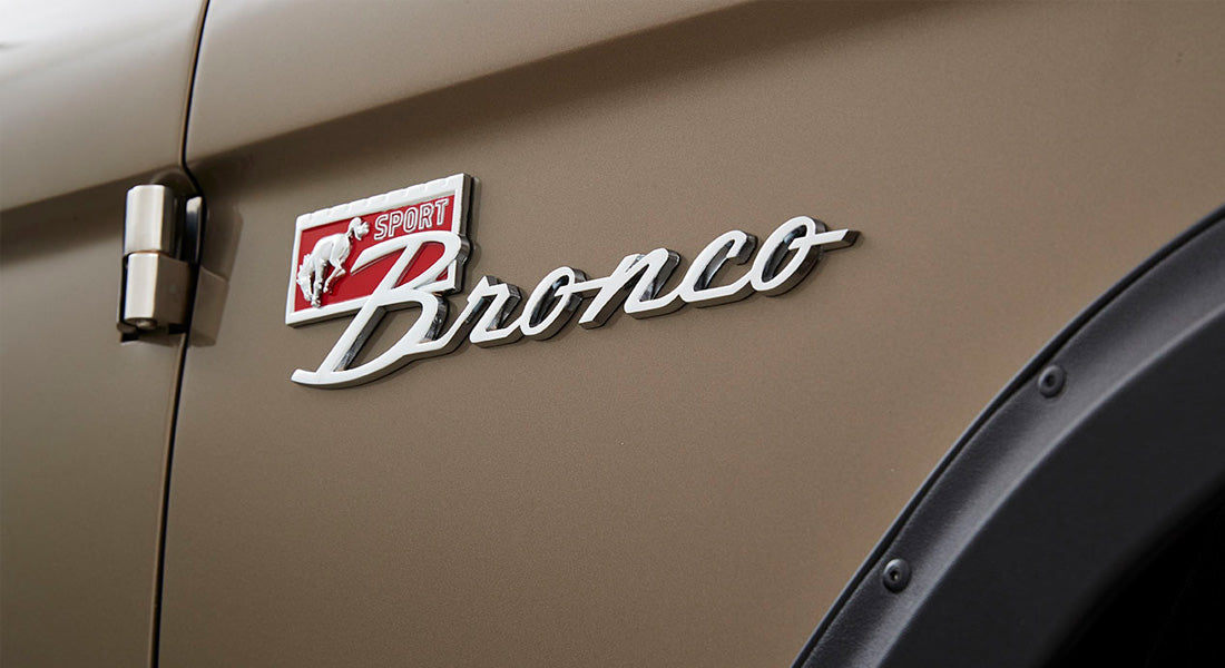 Bronco Sport emblem badge on the side panel of a Classic Ford Bronco