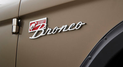 Bronco Sport emblem badge on the side panel of a Classic Ford Bronco