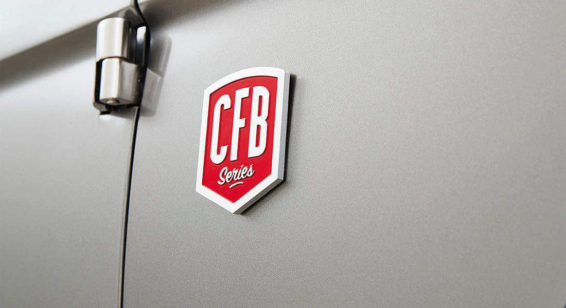 Red and white CFB Series emblem on light gray vehicle door