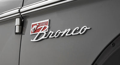 Bronco Sport emblem on gray Classic Ford Bronco door near hinge and handle