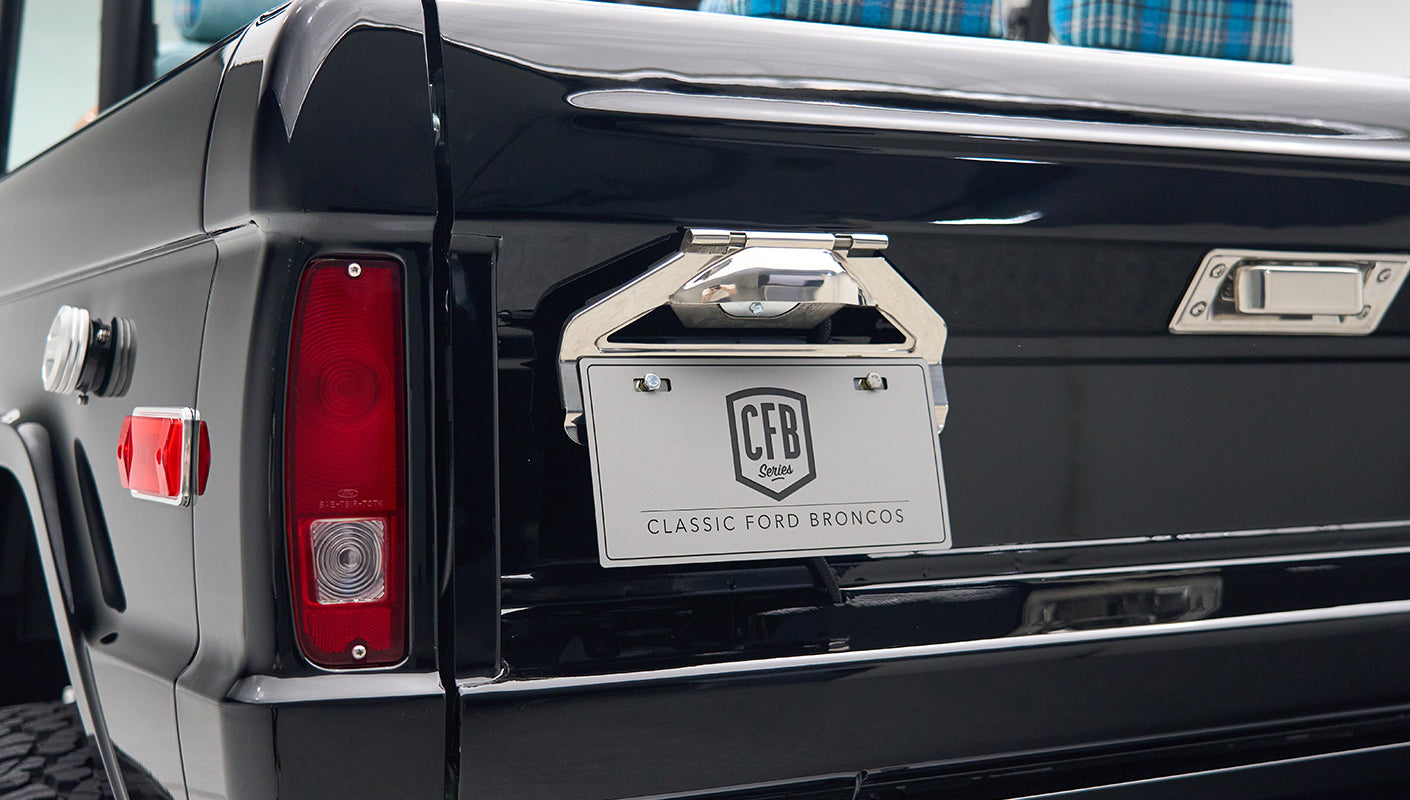 Rear view of Classic Ford Bronco tailgate with CFB Series plate and tail lights