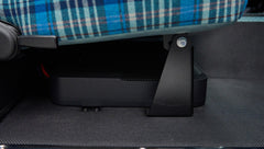 Under-seat storage compartment inside Classic Ford Bronco