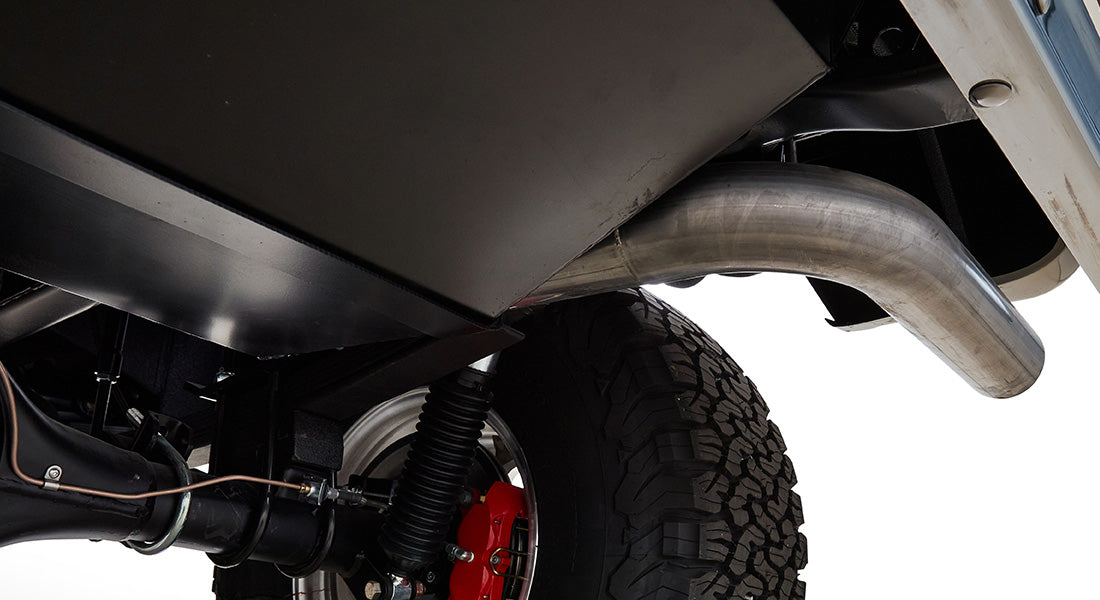Underside view of Classic Ford Bronco showing exhaust pipe and rear suspension