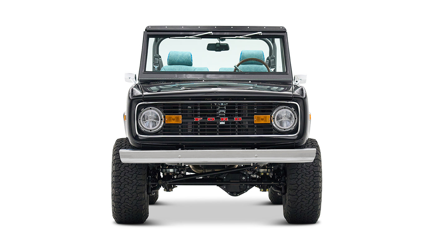 Front view of Classic Ford Bronco in black with raised suspension and clear windshield