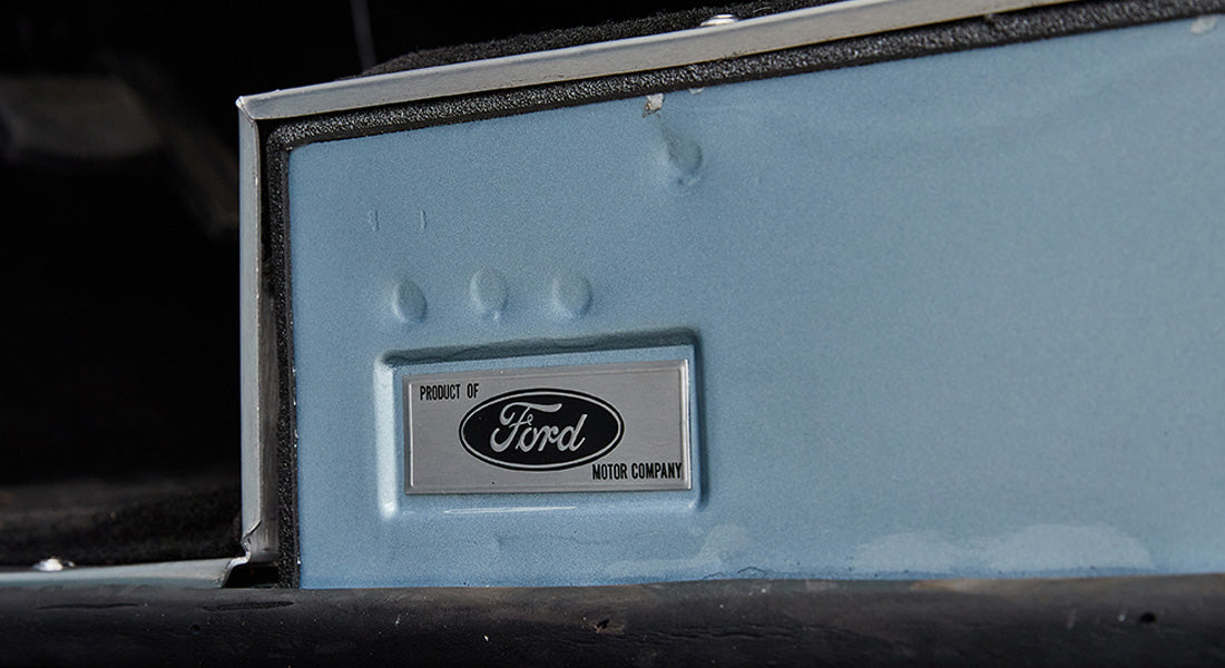 Interior panel of Classic Ford Bronco displaying Product of Ford Motor Company metal badge
