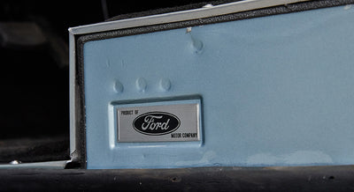 Interior panel of Classic Ford Bronco displaying Product of Ford Motor Company metal badge