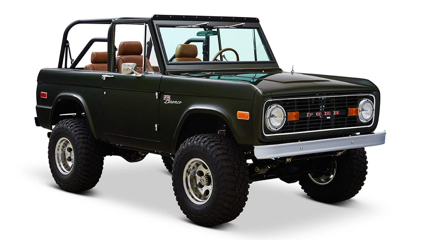 Classic Ford Bronco 1969 Misty Green Coyote Series angled front view showing brown seats
