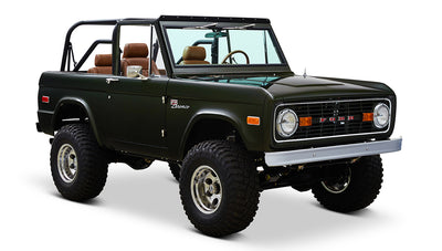 Classic Ford Bronco 1969 Misty Green Coyote Series angled front view showing brown seats