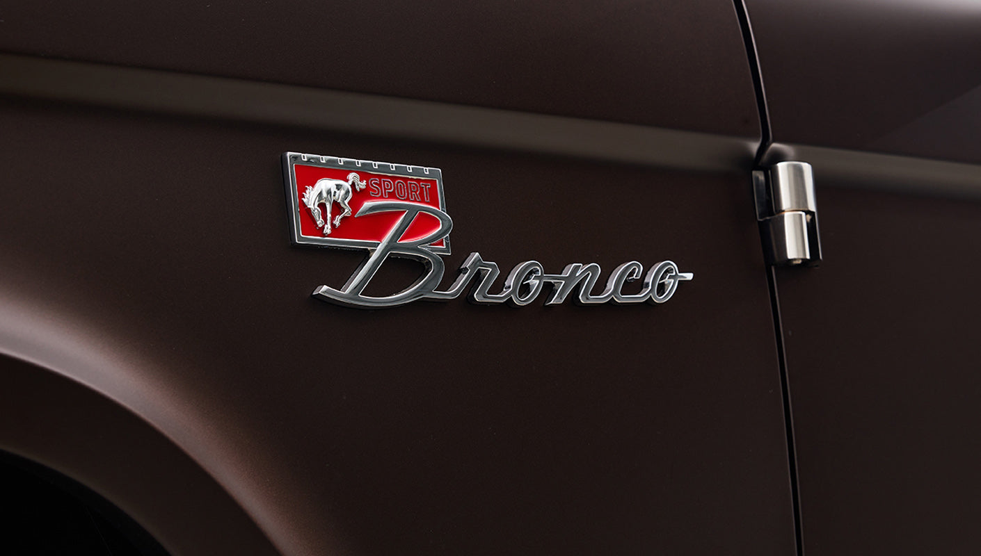 Ford Bronco 1970 in Matte Macadamia Brown with whiskey leather interior and black wheels Wooden Steering Wheel Alpine Stereo