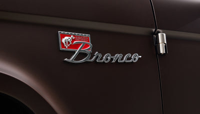 Ford Bronco 1970 in Matte Macadamia Brown with whiskey leather interior and black wheels Wooden Steering Wheel Alpine Stereo