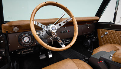 Ford Bronco 1970 in Matte Macadamia Brown with whiskey leather interior and black wheels Wooden Steering Wheel