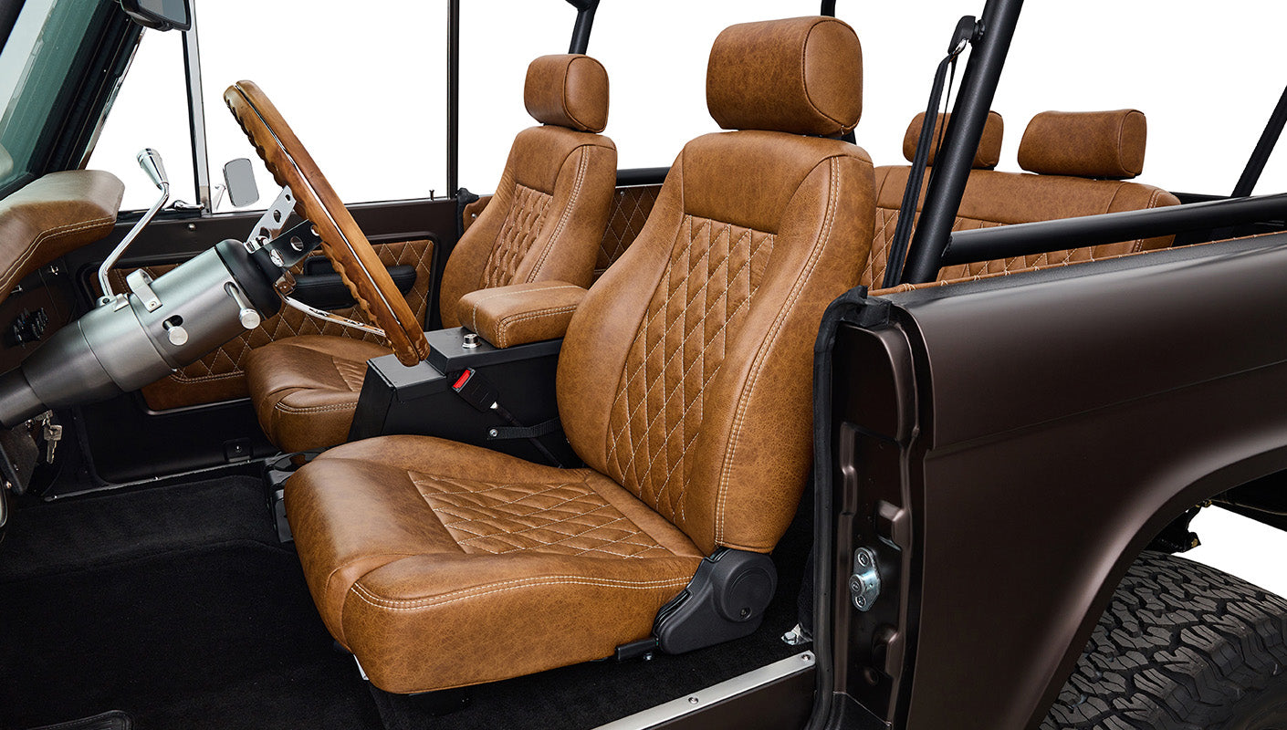 Ford Bronco 1970 in Matte Macadamia Brown with whiskey leather interior and black wheels Wooden Steering Wheel diamond stitch