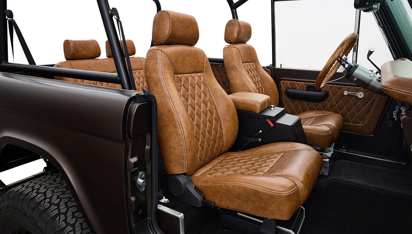 Ford Bronco 1970 in Matte Macadamia Brown with whiskey leather interior and black wheels Wooden Steering Wheel diamond stitch