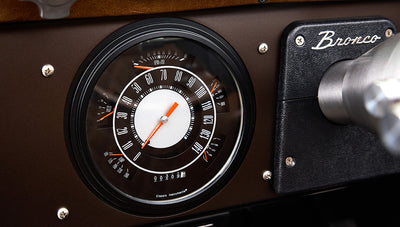 Ford Bronco 1970 in Matte Macadamia Brown with whiskey leather interior and black wheels Wooden Steering Wheel diamond stitch speedo