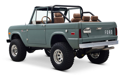 Classic Ford Bronco in marble gray seen from driver rear angled view