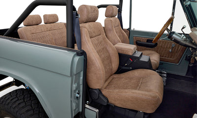Interior of Classic Ford Bronco with brown cloth seats viewed from passenger side