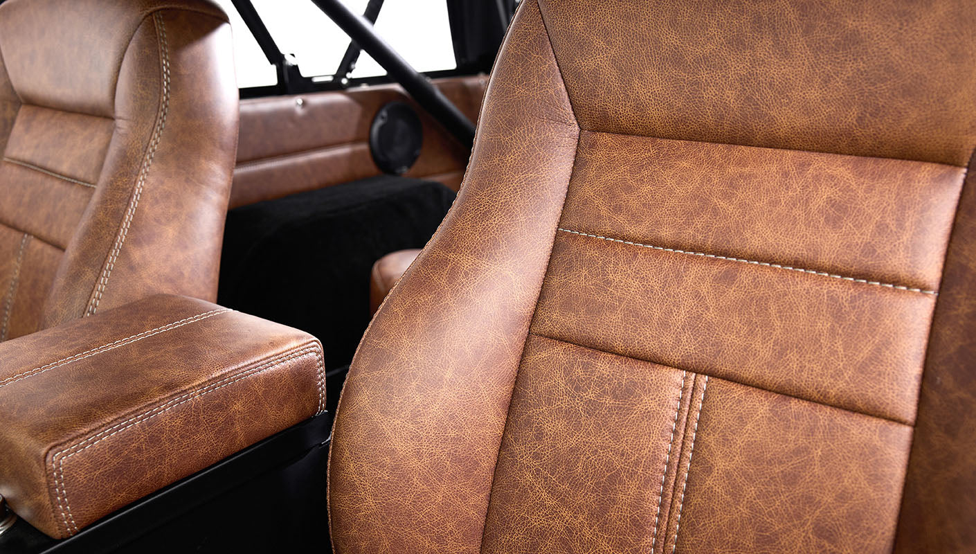 Ford Bronco 1977 302 Series in Adventurine Green with Black Soft Top and Custom Stitch Cigar Leather Interior