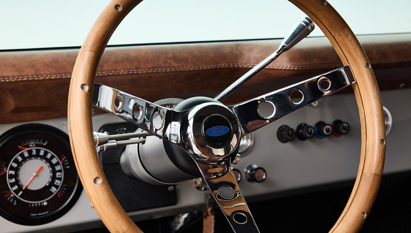 Ford Bronco 1977 302 Series in Adventurine Green with Black Soft Top and Custom Stitch Cigar Leather Interior