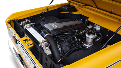 Ford Bronco 1975 in Chrome Yellow with custom Basket Weave Interior and Wimbledon White Wheels
