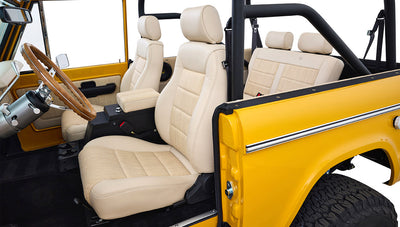 Ford Bronco 1975 in Chrome Yellow with custom Basket Weave Interior and Wimbledon White Wheels