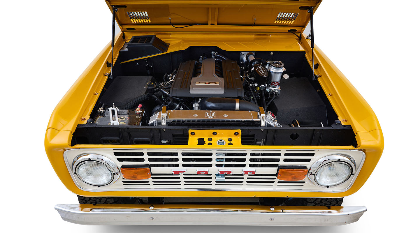 Ford Bronco 1975 in Chrome Yellow with custom Basket Weave Interior and Wimbledon White Wheels