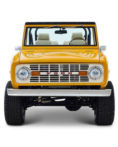 Ford Bronco 1975 in Chrome Yellow with custom Basket Weave Interior and Wimbledon White Wheels