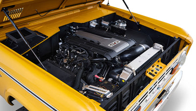 Ford Bronco 1975 in Chrome Yellow with custom Basket Weave Interior and Wimbledon White Wheels