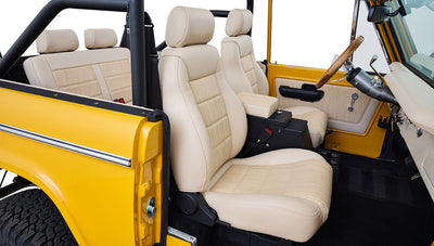 Ford Bronco 1975 in Chrome Yellow with custom Basket Weave Interior and Wimbledon White Wheels