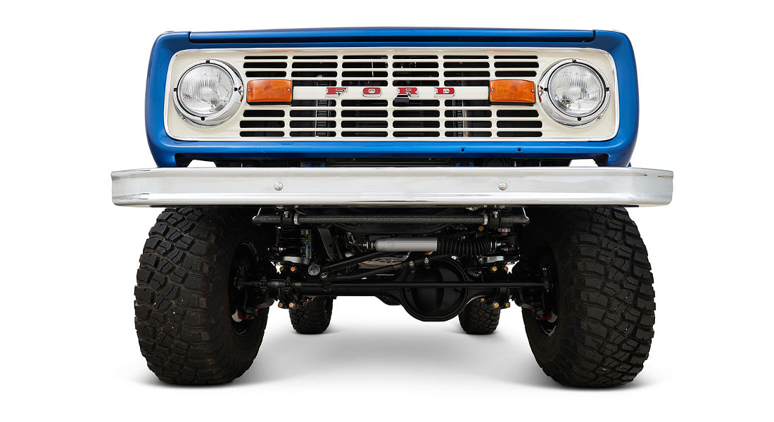 Front underside view of Classic Ford Bronco highlights suspension, axle, and tire tread