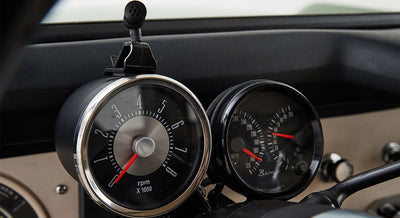 Classic Ford Bronco dashboard showing rpm and speed gauges