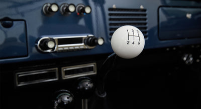 Classic Ford Bronco interior showing white spherical gear shift knob with 5-speed pattern