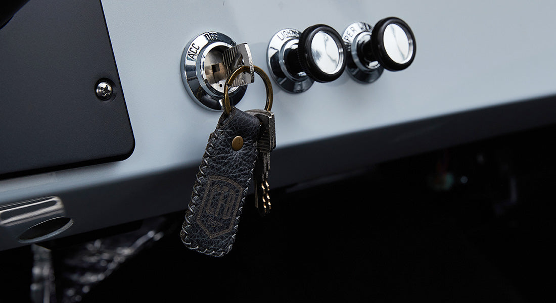 Black leather keychain with keys inserted in Classic Ford Bronco ignition