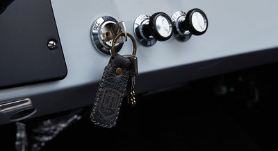 Black leather keychain with keys inserted in Classic Ford Bronco ignition