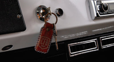 Leather keychain with CFB Series logo hanging from Classic Ford Bronco ignition