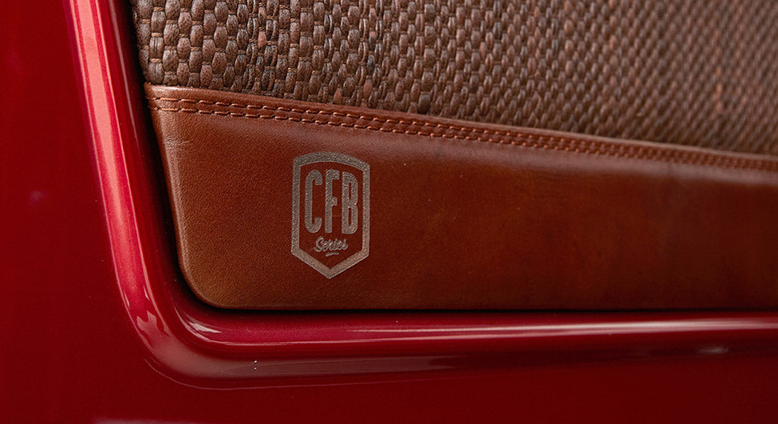 Brown leather panel with a CFB Series logo etched on Classic Ford Bronco door interior