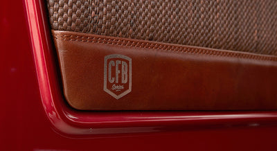 Brown leather panel with a CFB Series logo etched on Classic Ford Bronco door interior