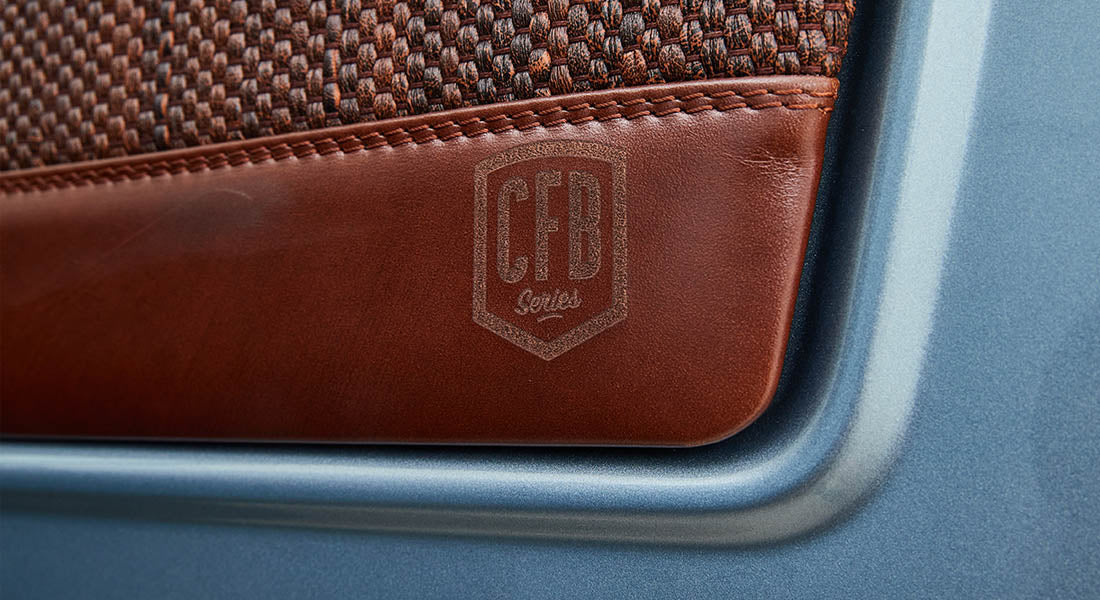Brown leather door panel with laser-etched CFB Series logo on Classic Ford Bronco