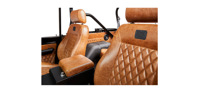 Tan leather upholstery with diamond stitch pattern on Classic Ford Bronco seats and door panels