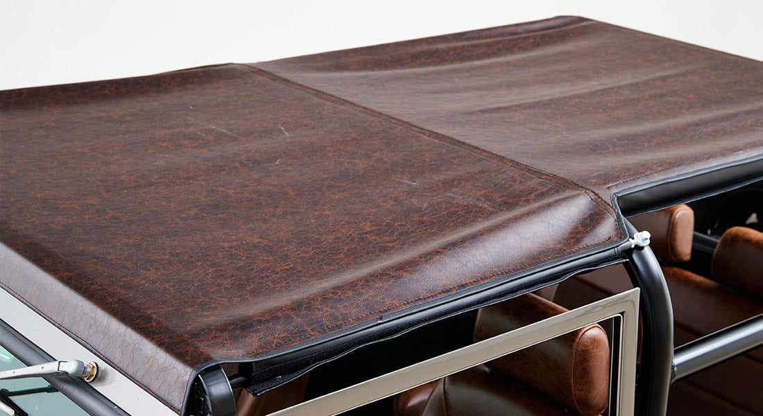 Brown leather top roof of Classic Ford Bronco, partially covering interior seats