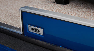 Blue panel with silver Ford Motor Company emblem on a Classic Ford Bronco