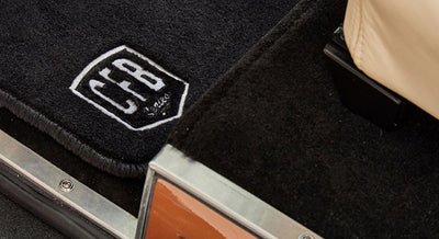 Black carpet mat featuring an embroidered CFB logo