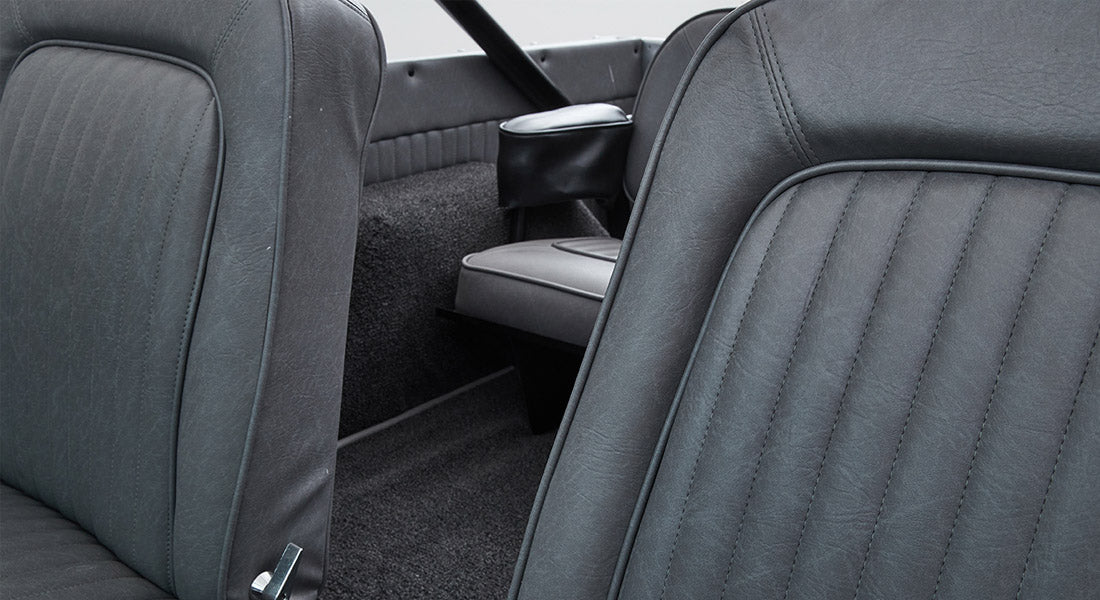 Close-up of gray upholstery seats and rear interior of Classic Ford Bronco