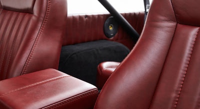 Red leather seats with stitching detail in Classic Ford Bronco interior