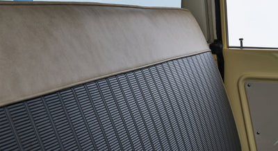 Close-up of two-tone vinyl and fabric seat upholstery in Classic Ford Bronco interior